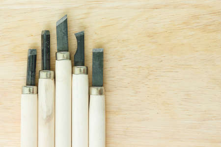 chisel carving set on wooden background