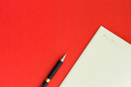 love diary valentine day notebook on red backgroundの写真素材