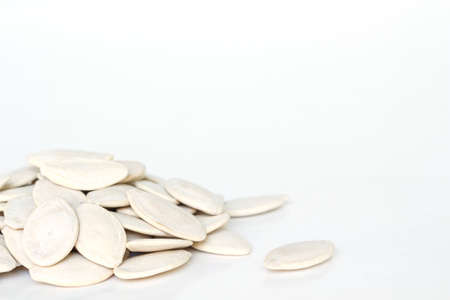 pumpkin seeds for planting on white backgroundの写真素材