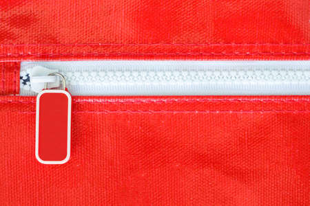 white zipper on red bagの写真素材