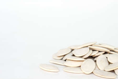 pumpkin seeds for planting on white backgroundの写真素材