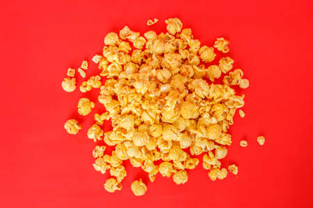 popcorn white pile on red backgroundの写真素材