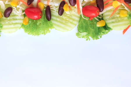 green salad fresh vegetable border on white backgroundの写真素材