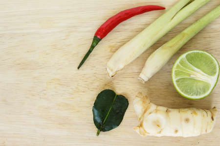 ingredients tom yom goong, lemongrass, galangal, kaffir lime leaves, lime, chili, thai food herbs nature backgroundの写真素材
