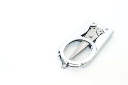 silver scissors cutting on white background