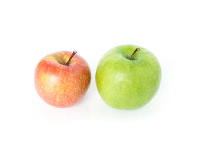 red apple and green apple on white backgroundの写真素材