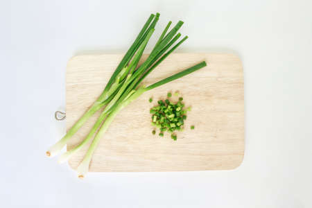 green onion vegetable cutting board nature food on cutting board backgroundの写真素材