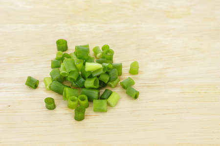 green onion cutted chives nature food on wood cutting board background