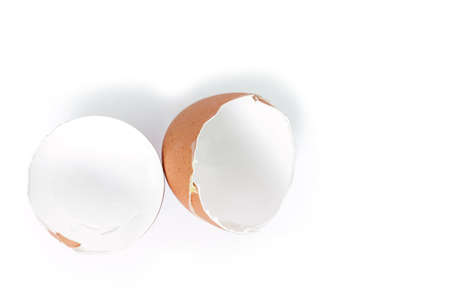 egg shell broken crack pile food on white backgroundの写真素材