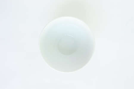 white bowl top view on white backgroundの写真素材
