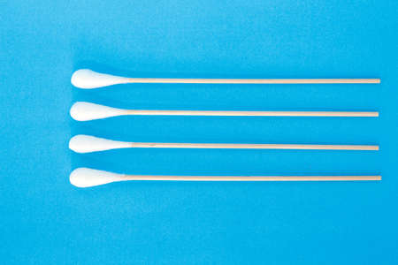 cotton bud, swab clean healthcare top view on blue background