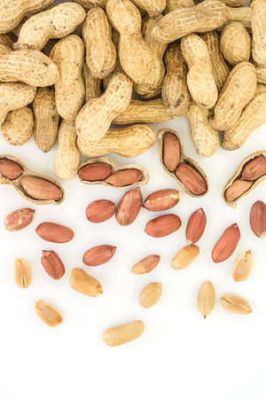 peanut in shell frame border top view on white backgroundの写真素材