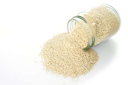 white sesame seed in jar on white background