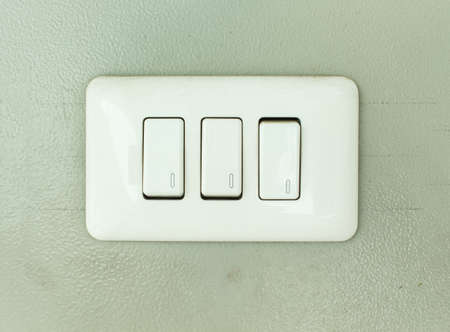 switch on off electric home on wall backgroundの写真素材