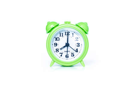 green alarm clock on white backgroundの写真素材