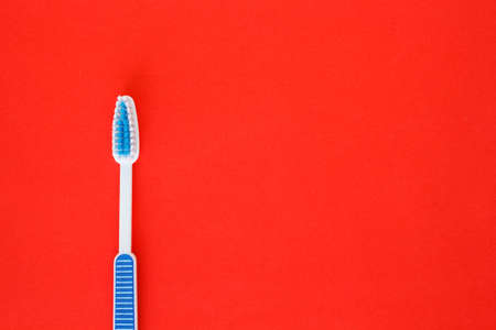 toothbrush health care on red background