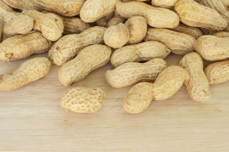 peanut in shell on wood backgroundの写真素材