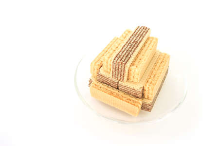 wafer chocolate milk dessert  on glass plate on white backgroundの写真素材