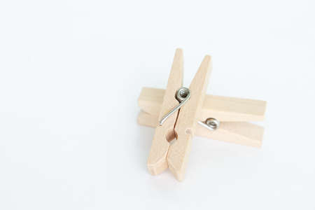 wooden clothes pin on white background.