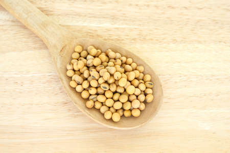 soy bean plant seed in spoon healthy vegetable food on wooden  backgroundの写真素材