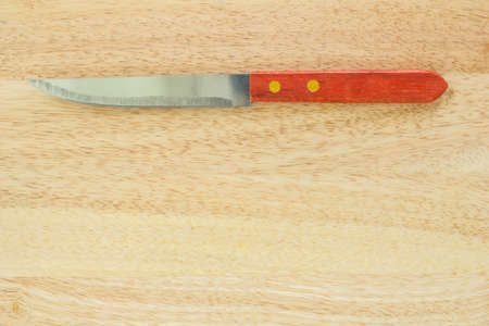kitchen knife on wooden table.の写真素材