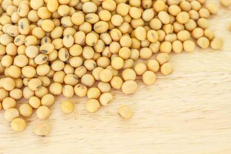soy bean pile on wooden  background top view.の写真素材