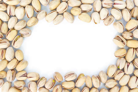 pistachio top view frame or border on white background.の写真素材