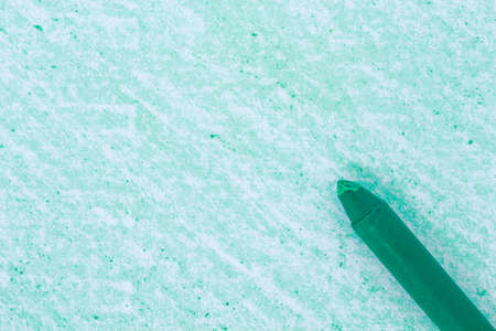 green crayon drawings on white paper background textureの写真素材