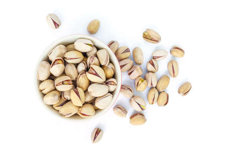 pistachio in bowl on white background.