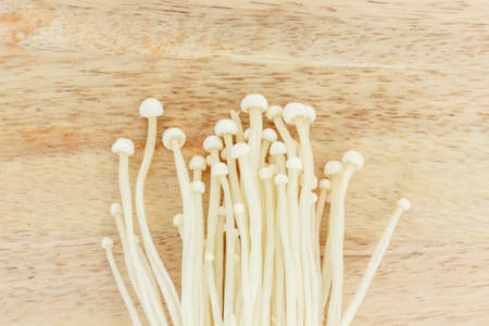 mushrooms top view on wooden background.