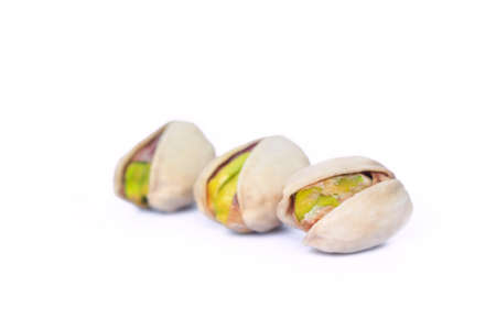 three pistachio on white background.の写真素材