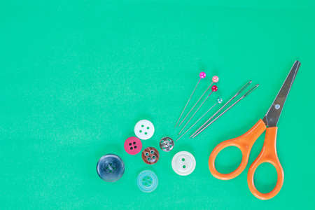 accessory sewing on green background.の写真素材