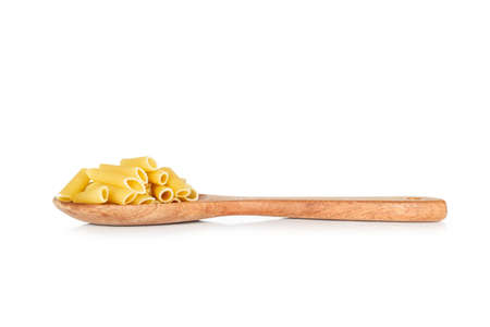 dry pasta penne Italian food in a spoon on white background.の写真素材