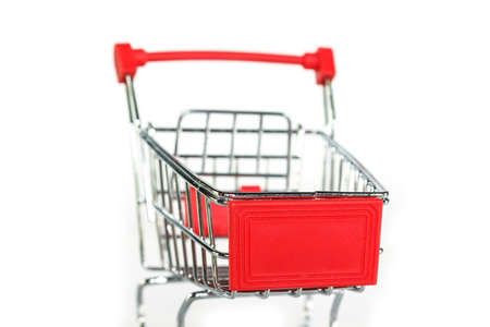 red shopping cart on white background.の写真素材