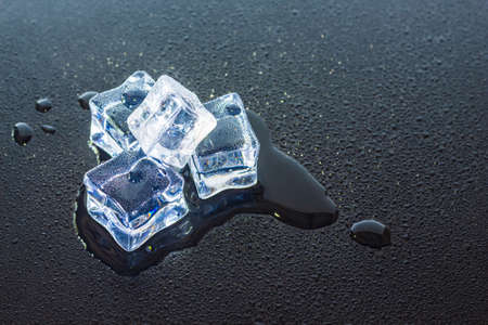 group ice cubes on black background.