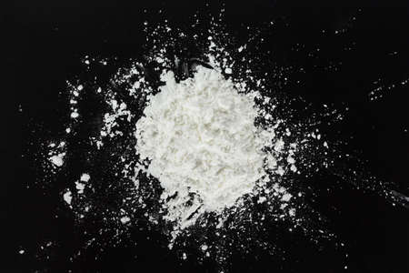 white flour  on black background.の写真素材