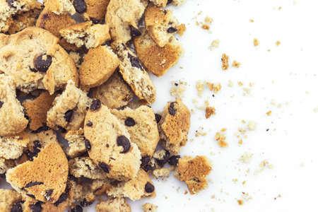 Cookies chocolate broken into pieces on white background.の写真素材
