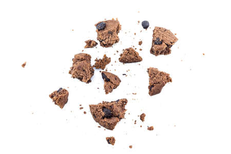 Cookies chocolate broken into pieces on white background.