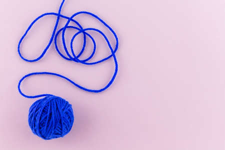 yarn color blue on pink background.の写真素材