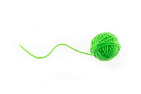 yarn color green on white background.の写真素材