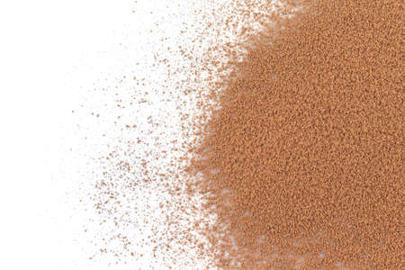 pile cocoa powder top view on white background.