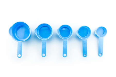 a set of measuring spoon of plastic on white background.の写真素材