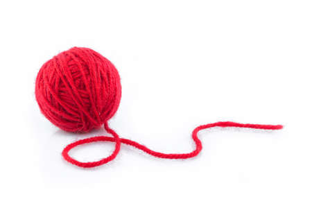 yarn color red on white background.の写真素材