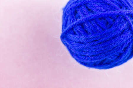yarn color blue on pink background.の写真素材