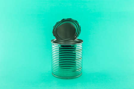 open tin can recycle protect environment on green background.の写真素材