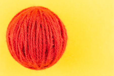 yarn color red on yellow background.