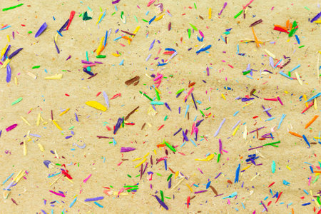 pencil color shaving on brown paper background.の写真素材