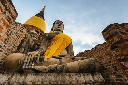 Ancient Buddha Statue at Wat yai chaimongkhon, Ayutthaya,Thailand.の写真素材