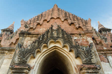 the front of ancient Htilo Minlo pagoda at dawn with blue sky blackground, Bagan, Myanmarの写真素材