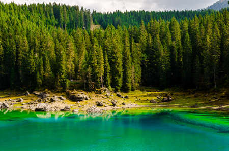 Beautiful view of famous Carezza lake at dolomite mountain, Italy.の写真素材